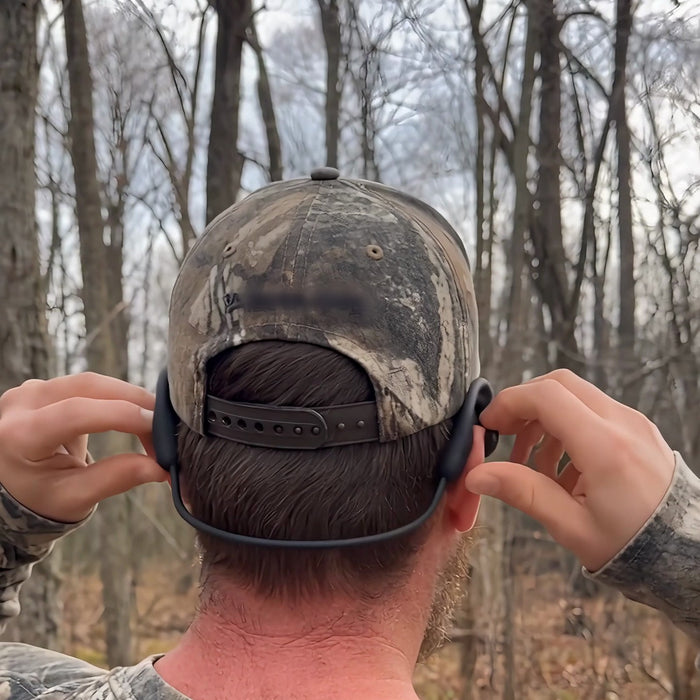 Echo Lens neckband worn under a camo cap, seen from behind